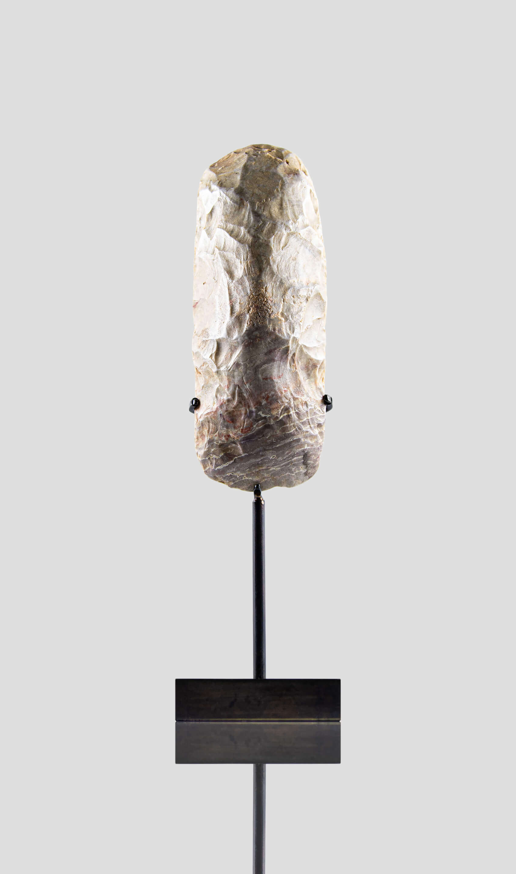 artefact hand axe for sale on bronze stand 2