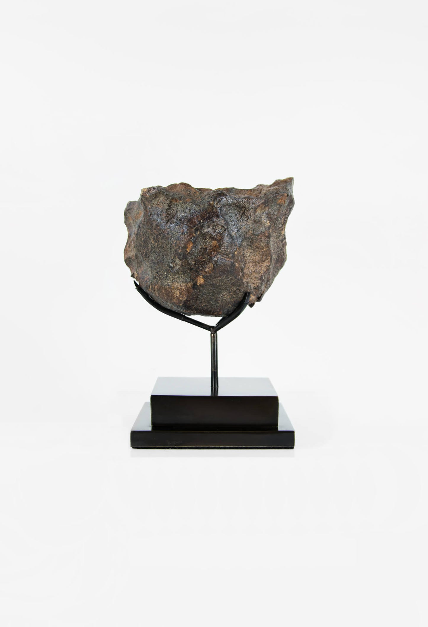 Our fallen star series NWA H5 Iron Meteorite for sale presented on a custom-designed bronze stand weighing 3055 grams