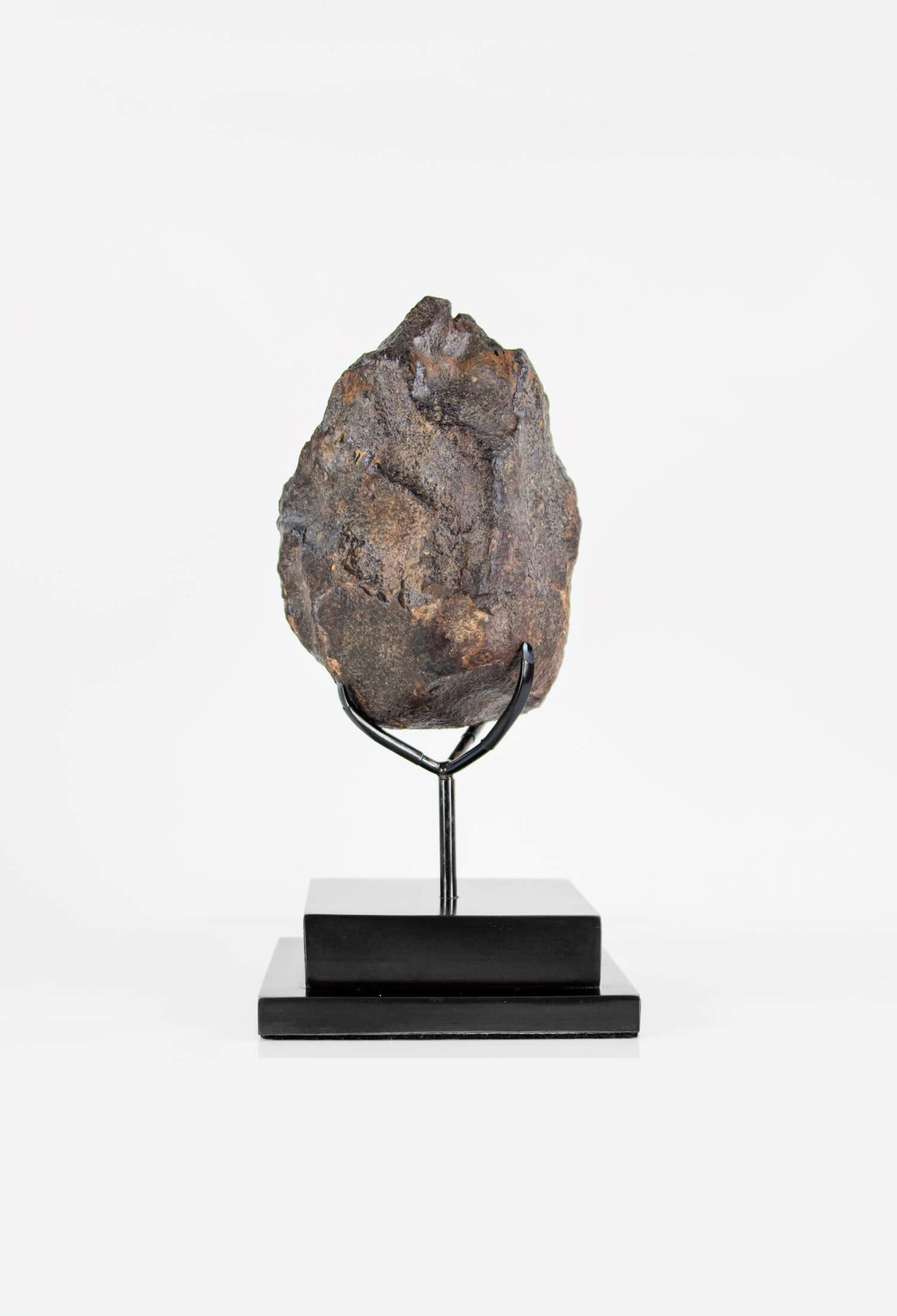 Our fallen star series NWA H5 Iron Meteorite for sale presented on a custom-designed bronze stand weighing 3055 grams