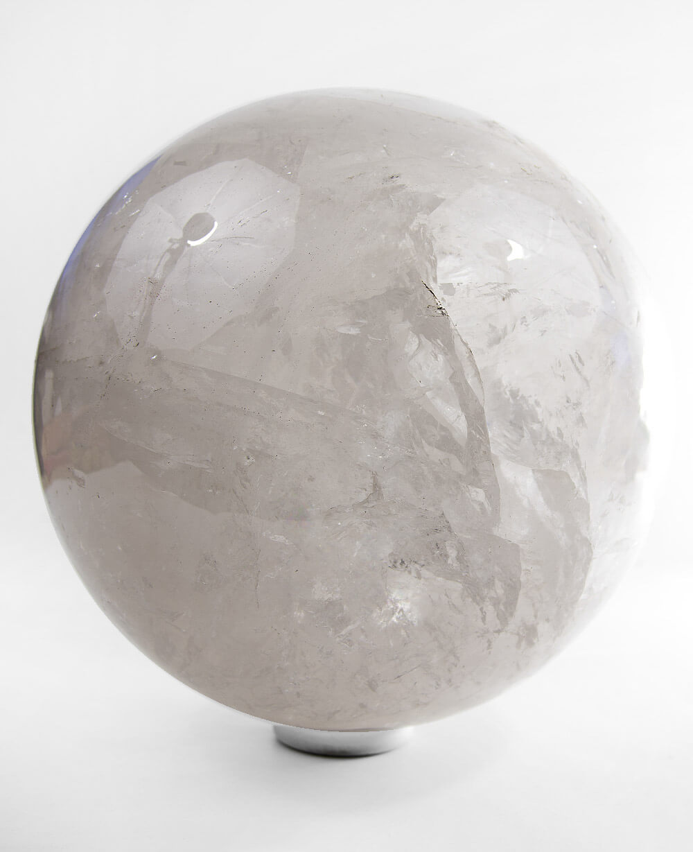 A beautifully hand crafted large Quartz there for center display on our stainless steel ring stand for spaces out there!