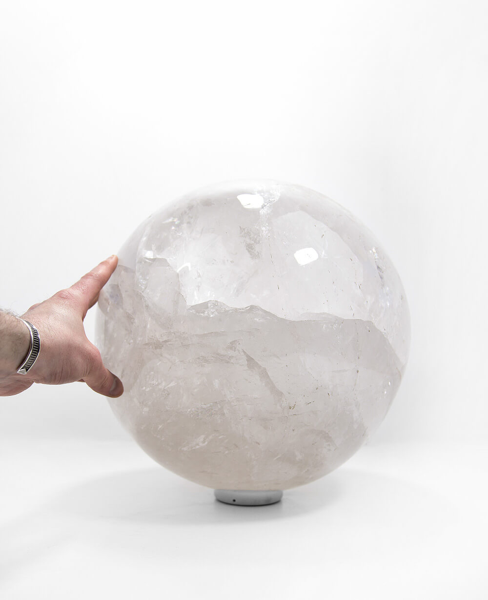 A beautifully hand crafted large Quartz there for center display on our stainless steel ring stand for spaces out there!