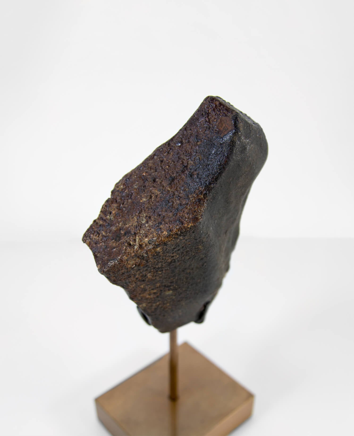 Our fallen star series NWA H5 Iron Meteorite for sale presented on a custom-designed bronze stand weighing 1349 grams