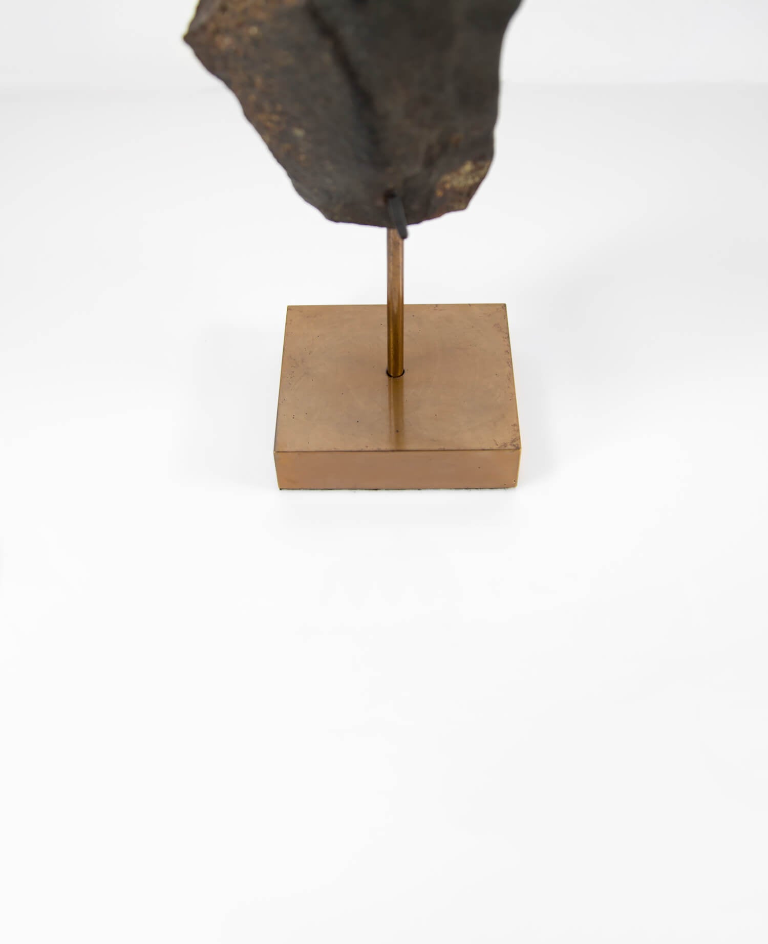 Our fallen star series NWA H5 Iron Meteorite for sale presented on a custom-designed bronze stand weighing 1349 grams