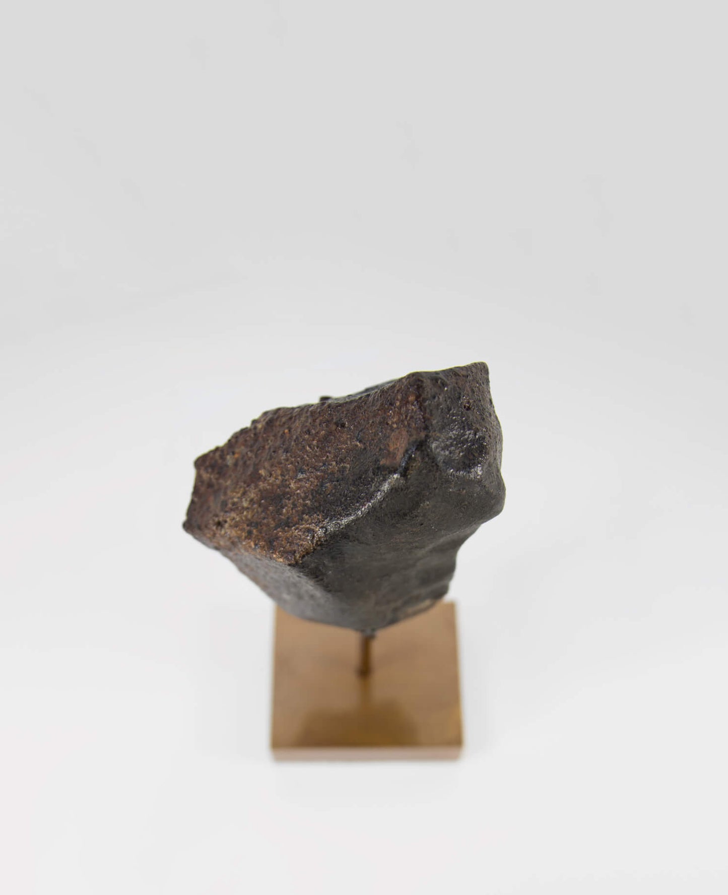 Our fallen star series NWA H5 Iron Meteorite for sale presented on a custom-designed bronze stand weighing 1349 grams