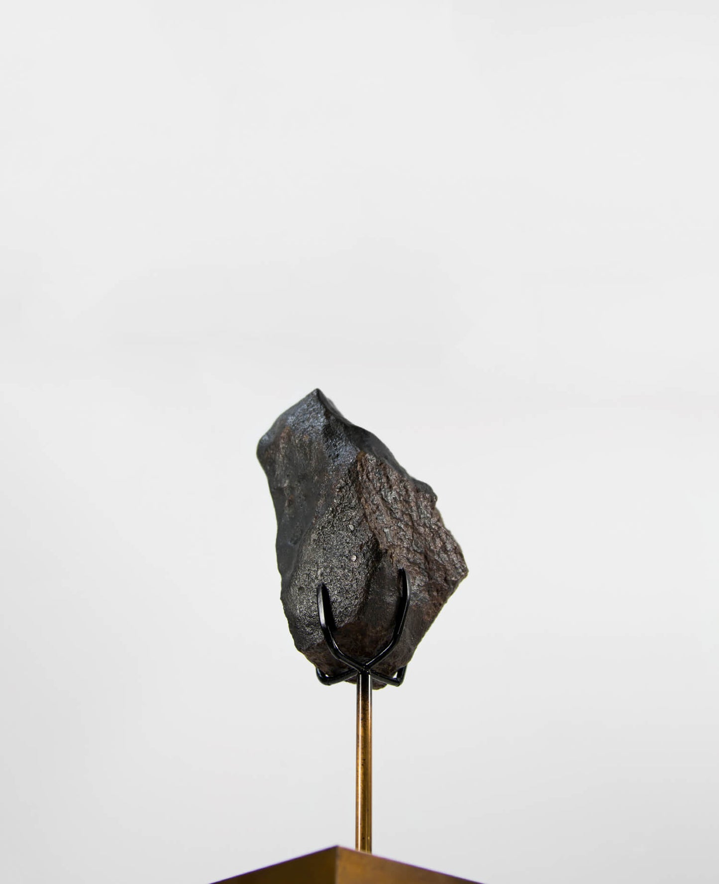 Our fallen star series NWA H5 Iron Meteorite for sale presented on a custom-designed bronze stand weighing 1349 grams