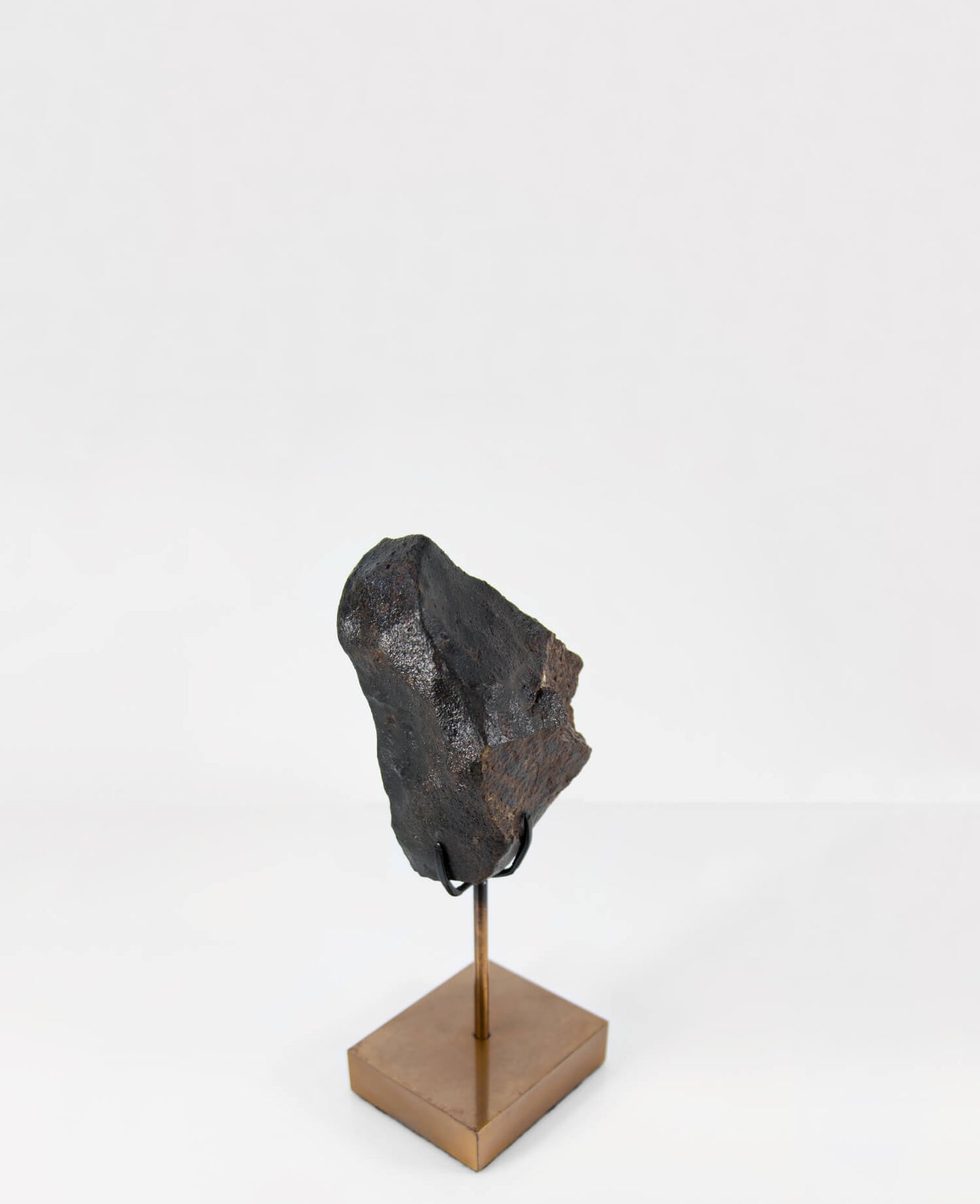 Our fallen star series NWA H5 Iron Meteorite for sale presented on a custom-designed bronze stand weighing 1349 grams