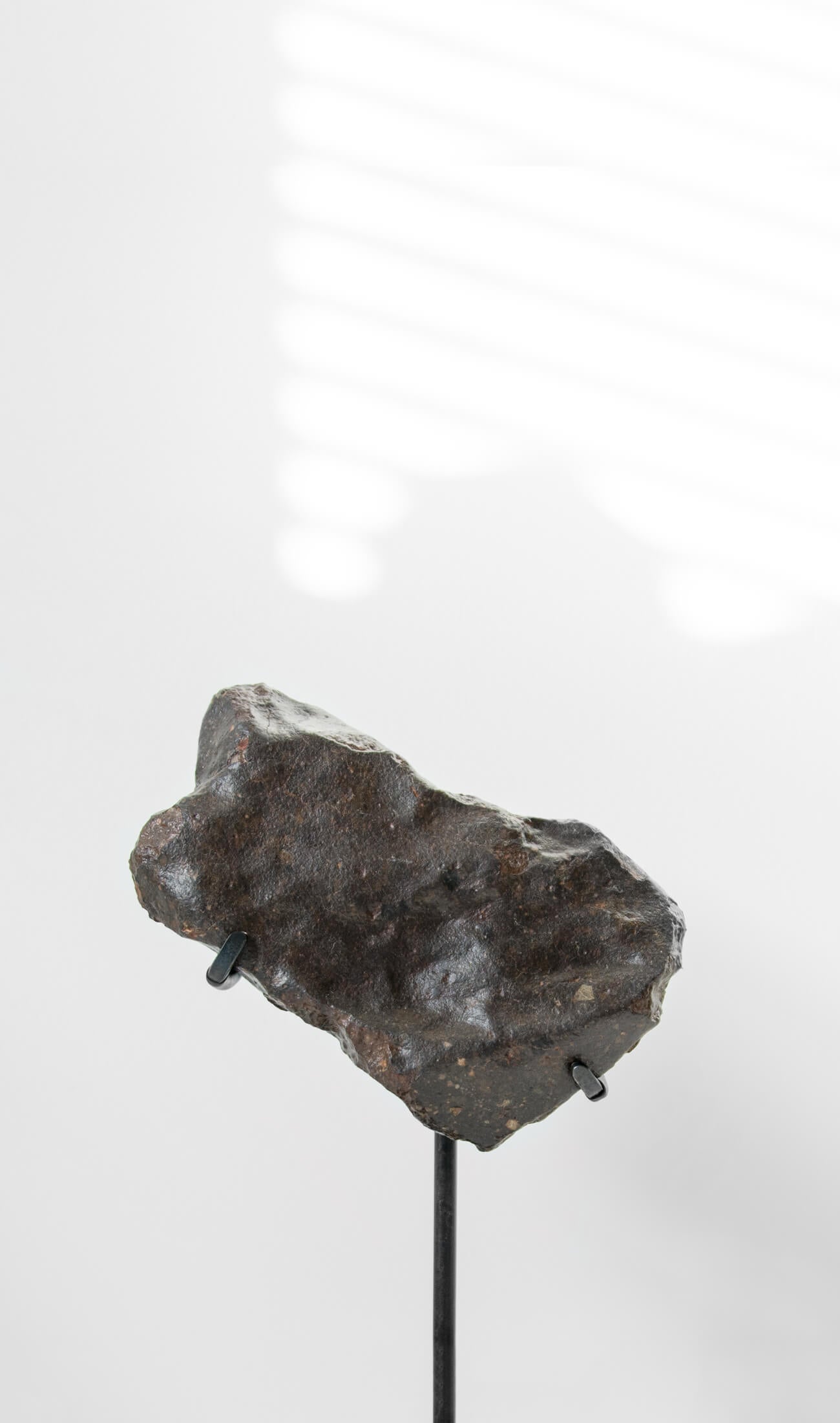 Our fallen star series NWA H5 Iron Meteorite presented on a luxury custom-designed bronze stand weighing 955 grams