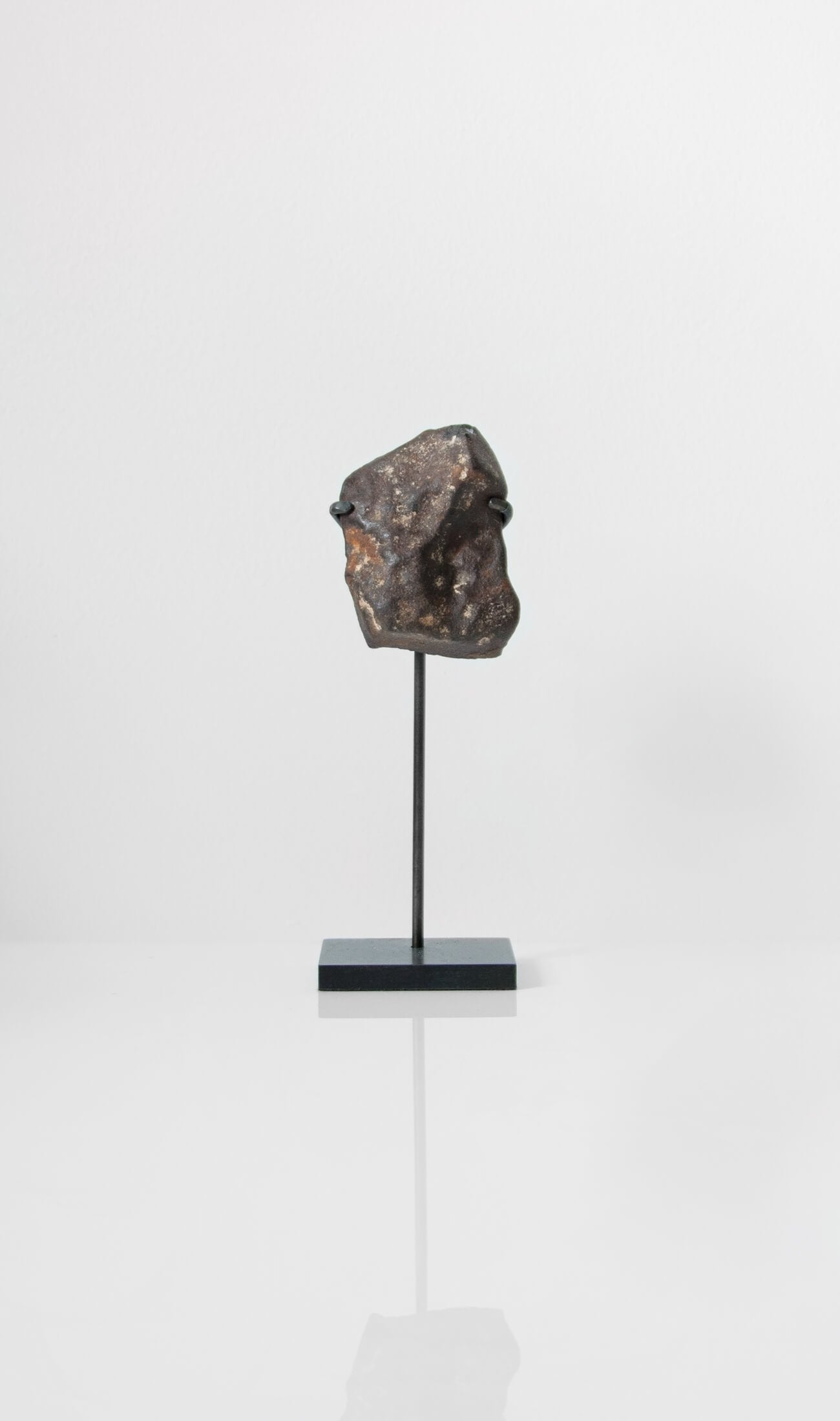 Our fallen star series NWA H5 Iron Meteorite for sale presented on a custom-designed bronze stand weighing 126 grams