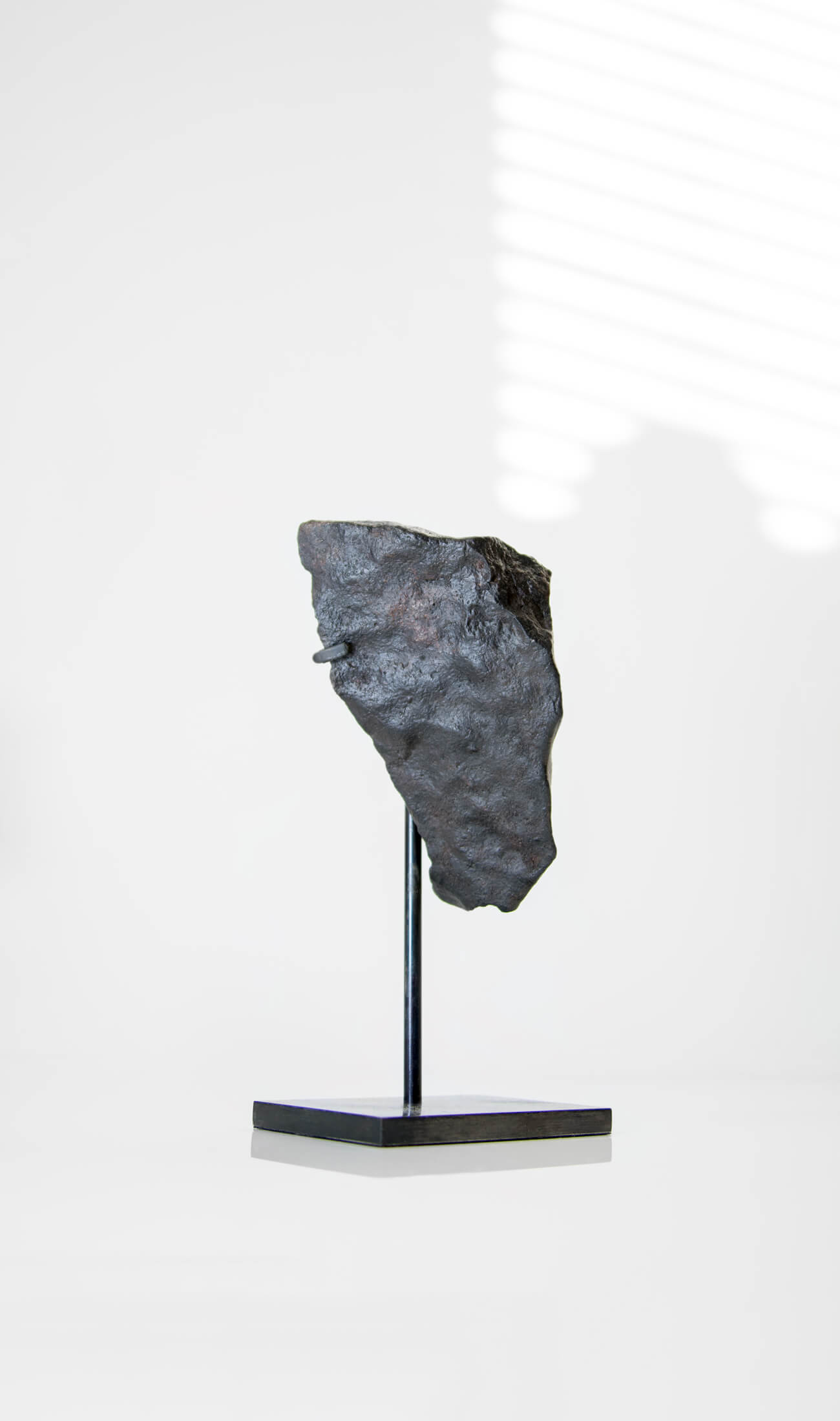 Our fallen star series NWA H5 Iron Meteorite presented on a luxury custom-designed bronze stand weighing 432 grams