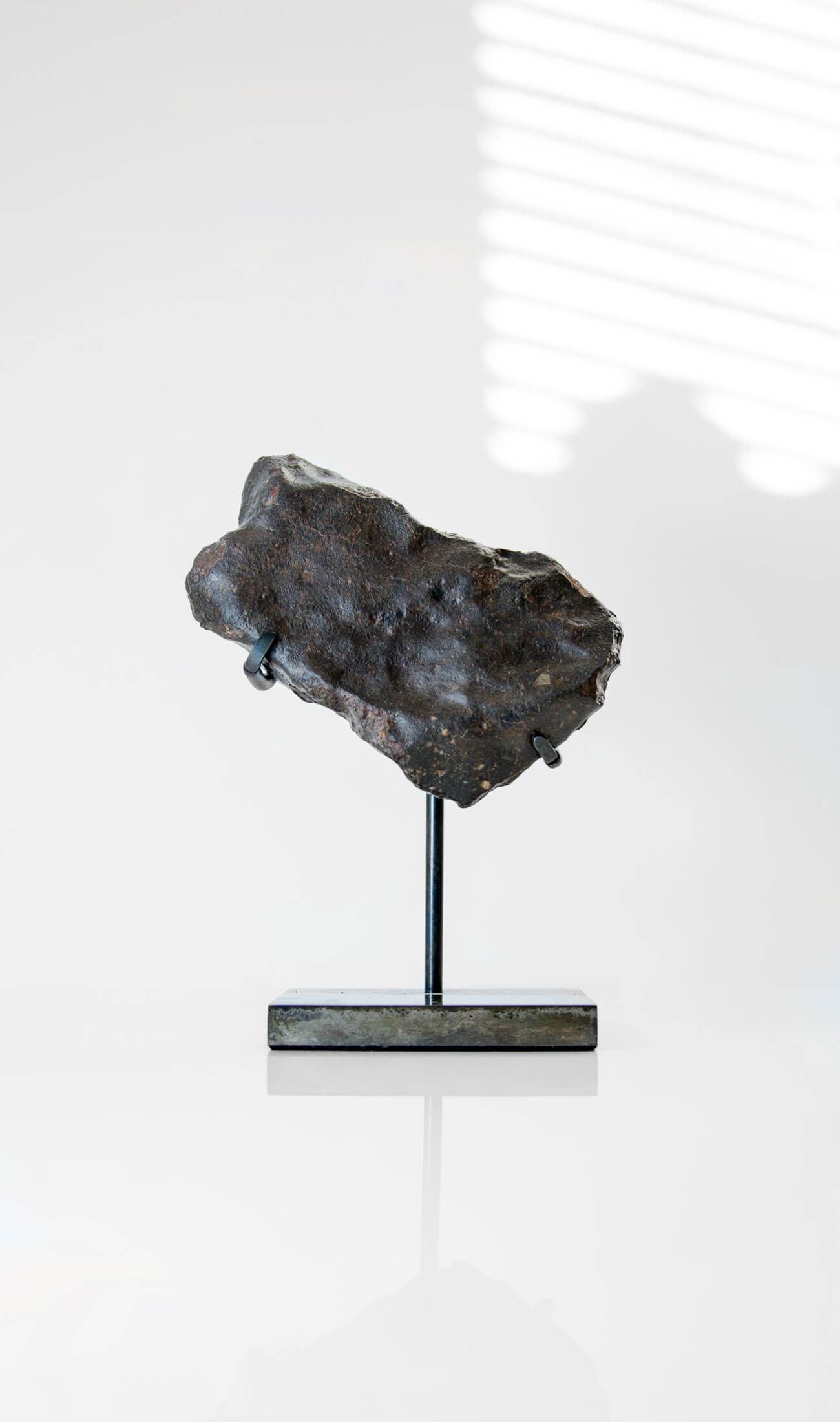 Our fallen star series NWA H5 Iron Meteorite presented on a luxury custom-designed bronze stand weighing 955 grams