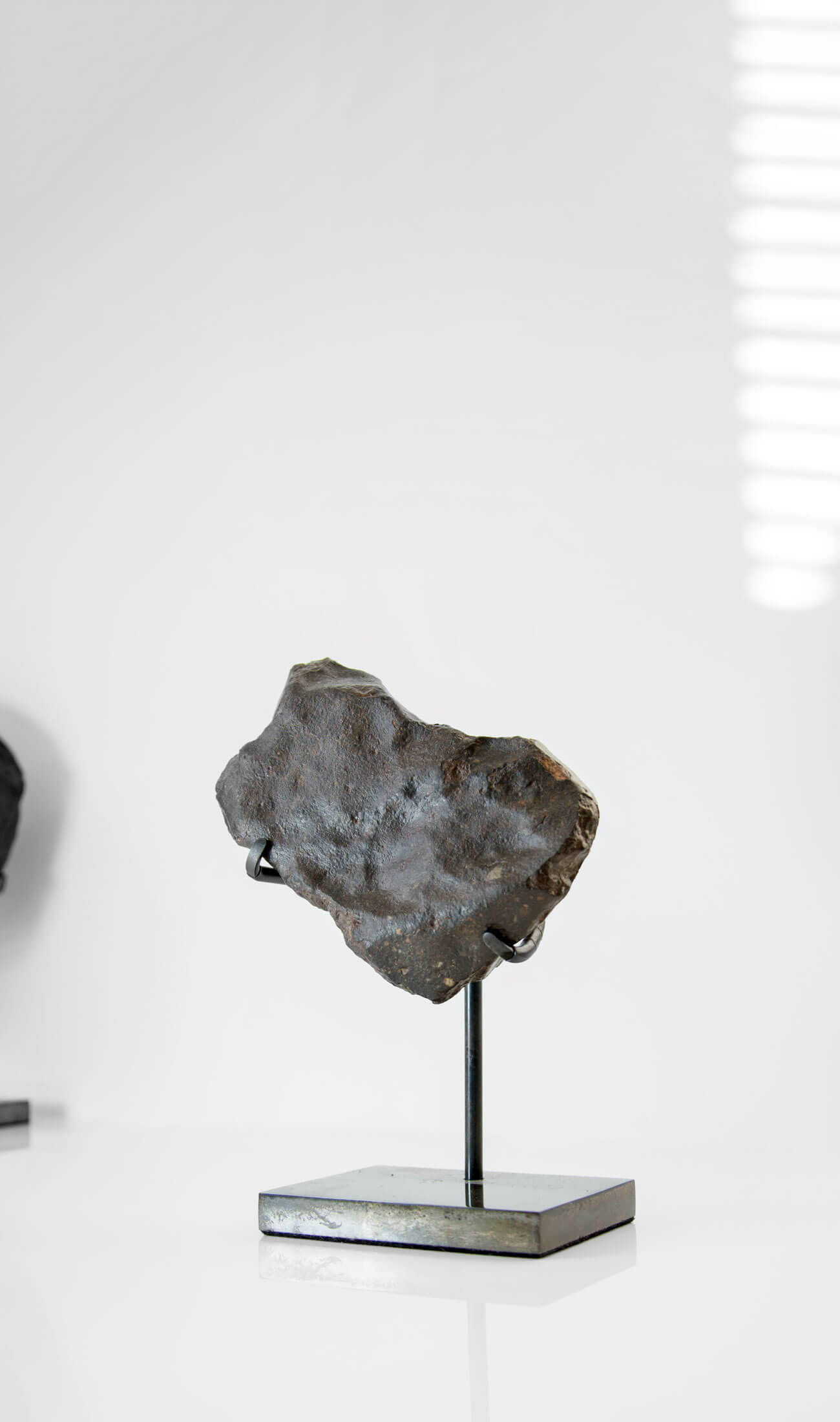 Our fallen star series NWA H5 Iron Meteorite presented on a luxury custom-designed bronze stand weighing 955 grams