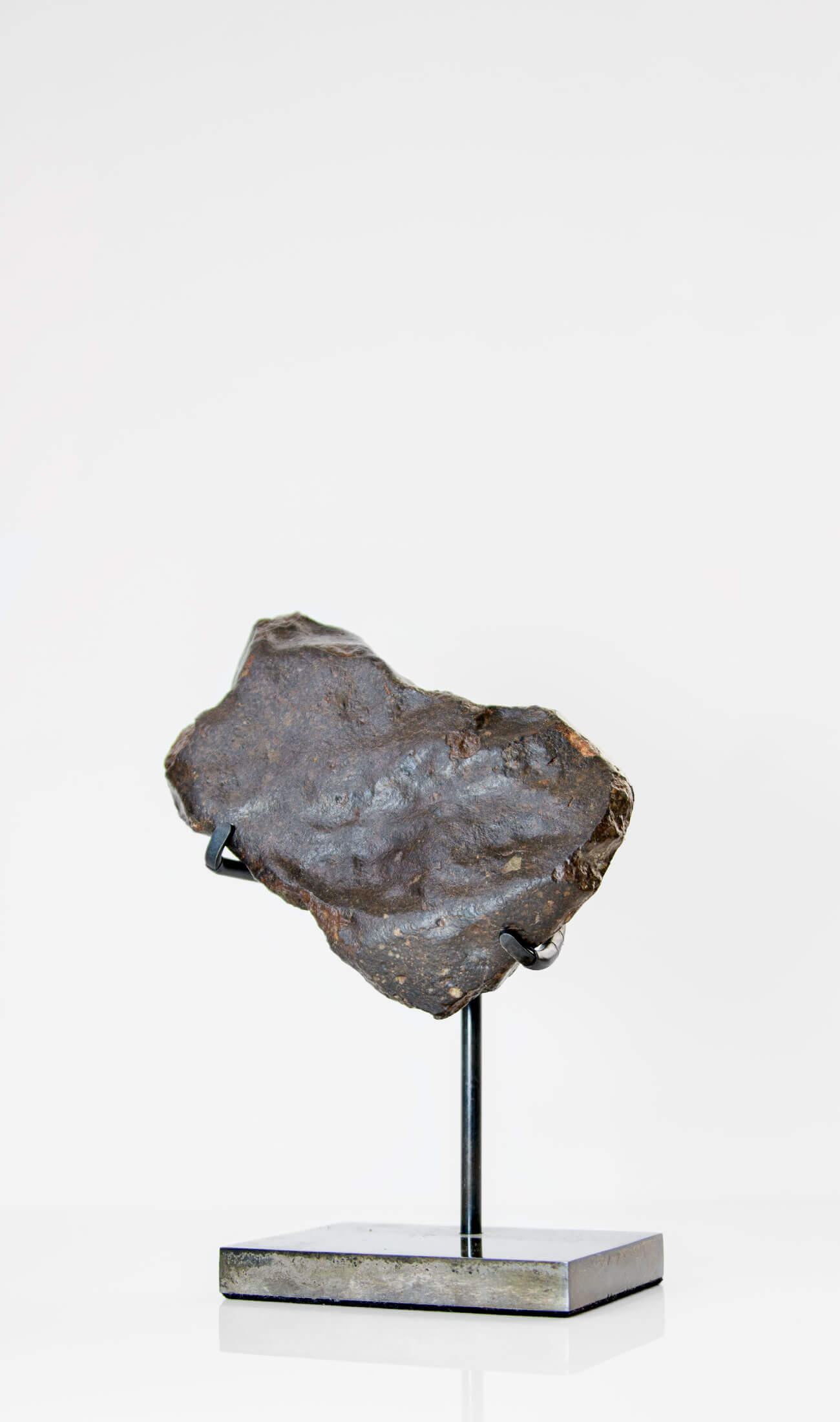 Our fallen star series NWA H5 Iron Meteorite presented on a luxury custom-designed bronze stand weighing 955 grams