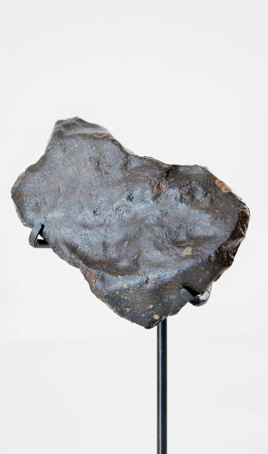 Our fallen star series NWA H5 Iron Meteorite presented on a luxury custom-designed bronze stand weighing 955 grams