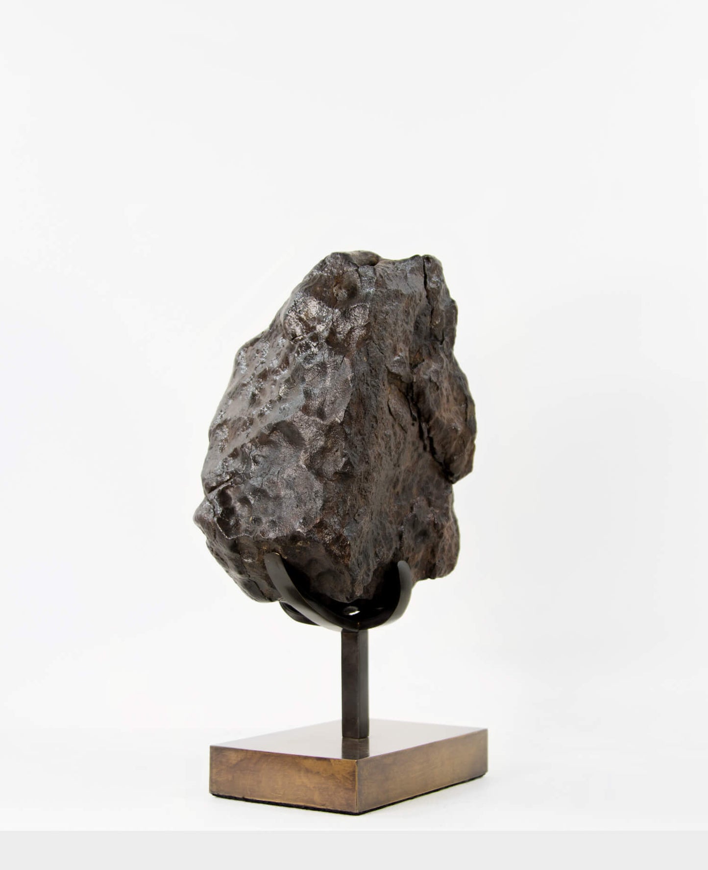 Our fallen star series brings you a NWA H5 Iron Meteorite presented on a luxury custom-designed bronze stand weighing 6.5 kg