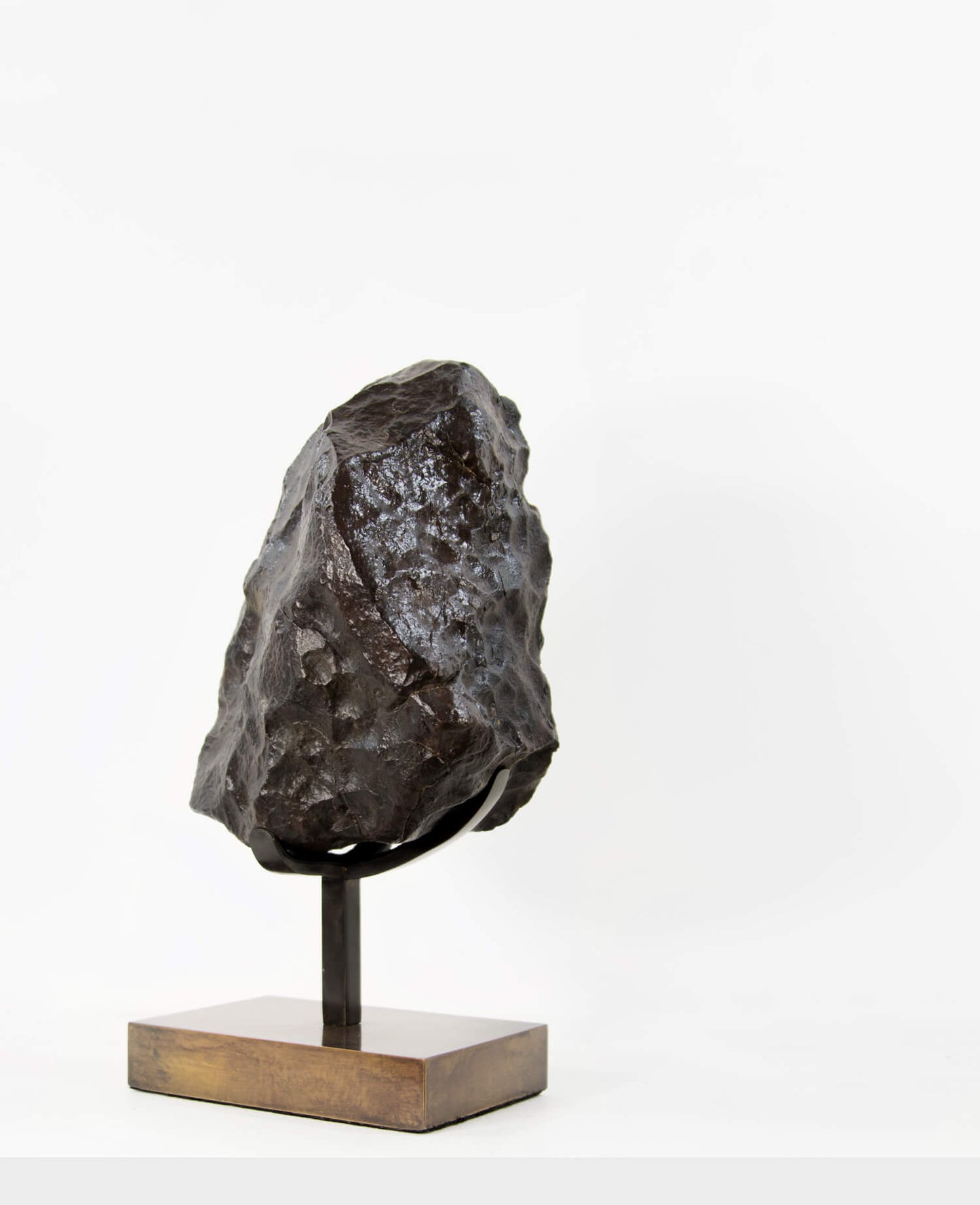 Our fallen star series brings you a NWA H5 Iron Meteorite presented on a luxury custom-designed bronze stand weighing 6.5 kg