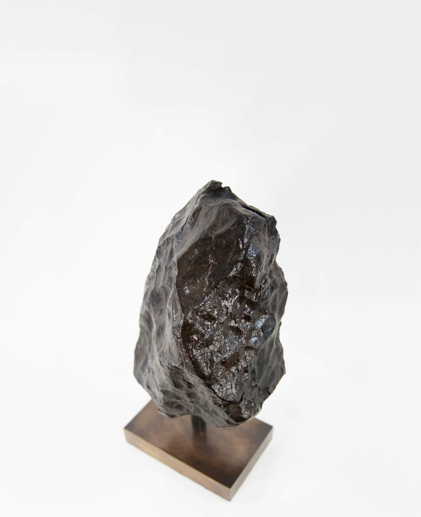 Our fallen star series brings you a NWA H5 Iron Meteorite presented on a luxury custom-designed bronze stand weighing 6.5 kg