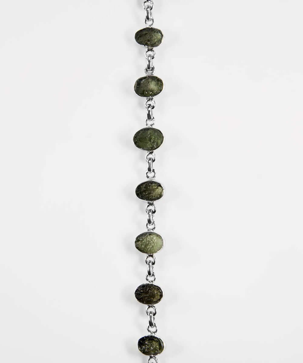 Own a beautiful green Moldavite gemstones for sale wrapped in a 925 silver bracelet now available at THE FOSSIL STORE