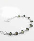 Own a beautiful green Moldavite gemstones for sale wrapped in a 925 silver bracelet now available at THE FOSSIL STORE