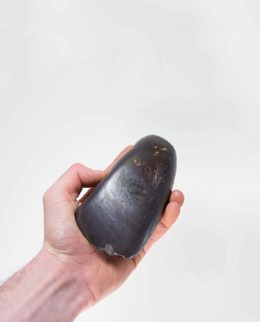 A stunning museum-standard rare authentic heavy hematite Neolithic hand axe measuring 125mm created by an ancient hand