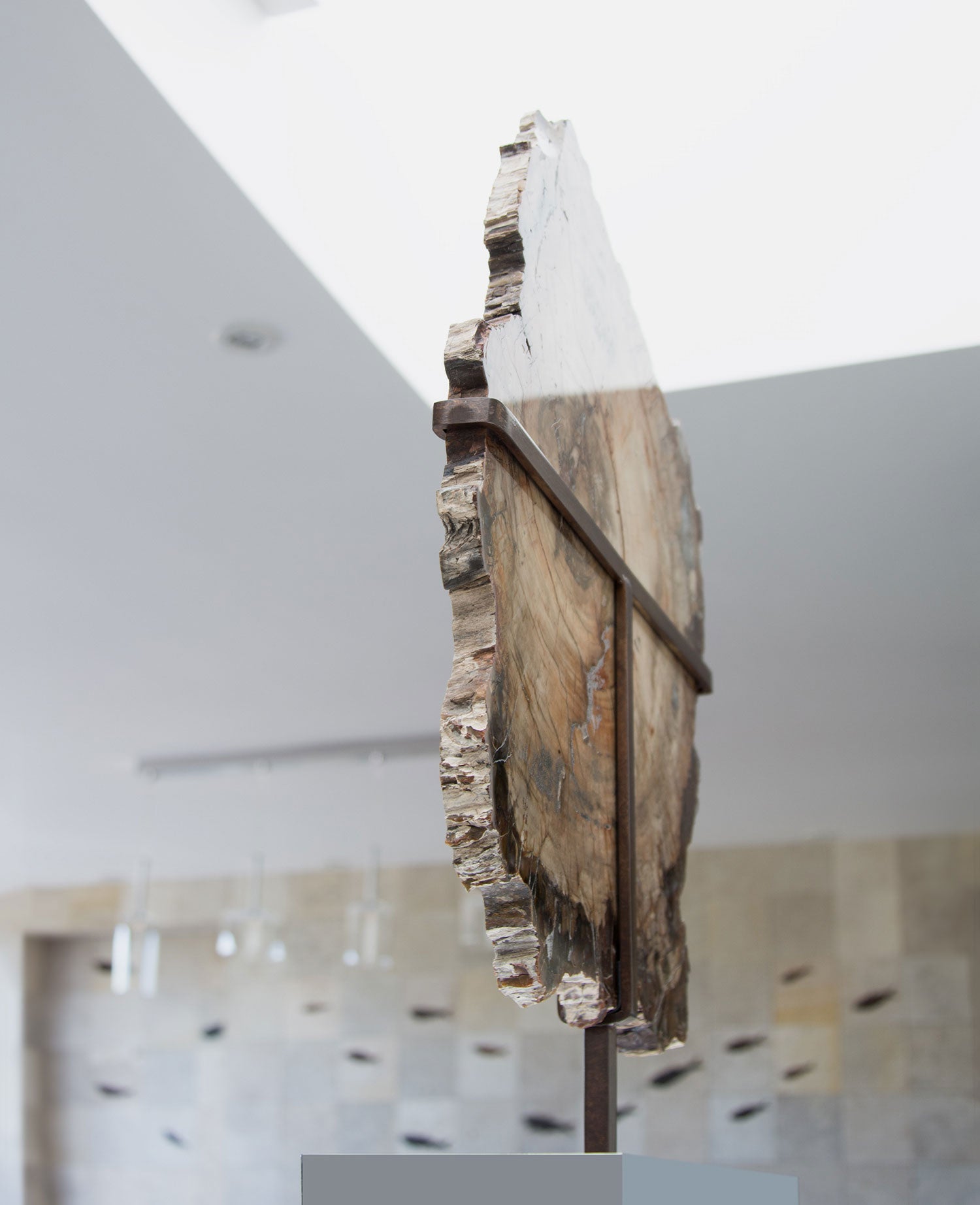 A wonderful example of a double-sided polished petrified wood slice measuring 600mm on a custom-designed bronze stand