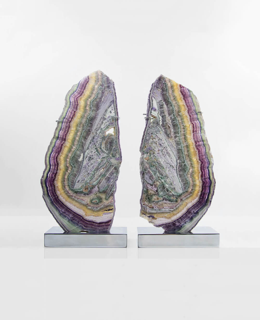 A stunning pair of mineral Fluorite sliced slabs presented on two chrome lamp stands for interior spaces